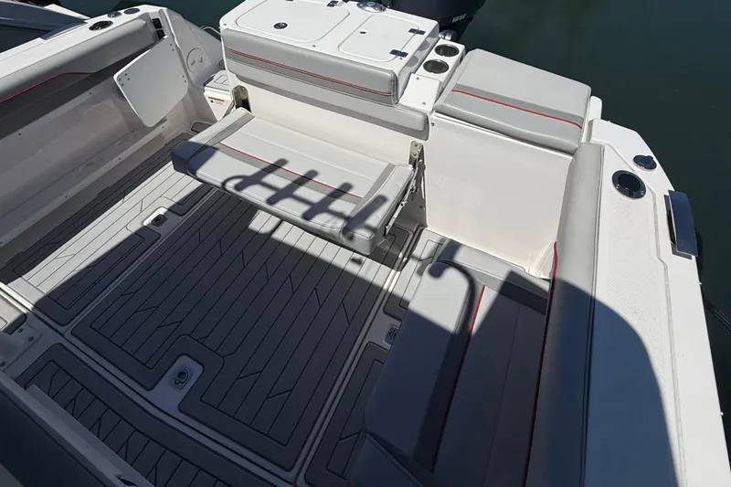 Slide: The Image of 2024 Solara S-250 CW boat interior with cushioned seating and sleek flooring design. - 9