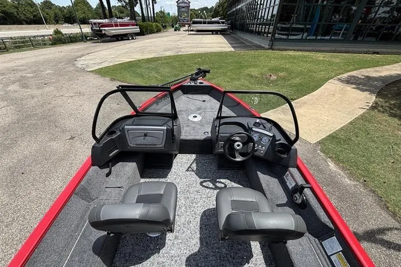 Slide: The Image of 2026 Tracker Pro Guide V-16 WT boat interior with dual seats and steering console. - 6