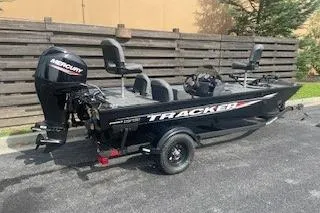 Slide: The Image of 2026 Tracker Pro 170 boat with Mercury engine, parked outdoors. - 66