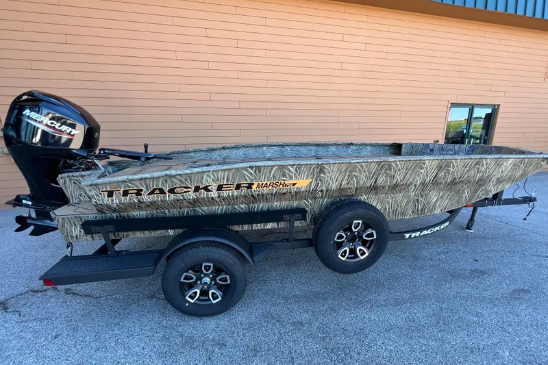 The Image of 2026 Tracker Grizzly 1756 T Marsh boat with camouflage design and Mercury engine. - 0