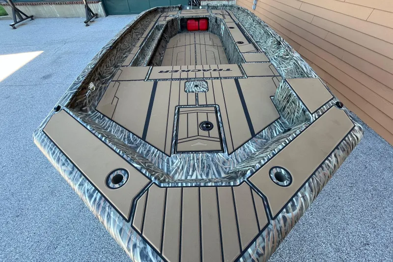 Slide: The Image of 2026 Tracker Grizzly 1756 T Marsh boat with camo design and spacious deck layout. - 5
