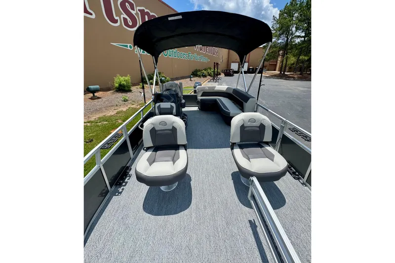 Slide: The Image of 2026 Sun Tracker Bass Buggy 16 XL Select pontoon boat with seating and canopy. - 2