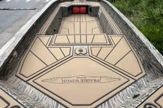 Slide: The Image of 2026 Tracker Grizzly 1650 T Prairie Wings Edition boat interior with custom design. - 3