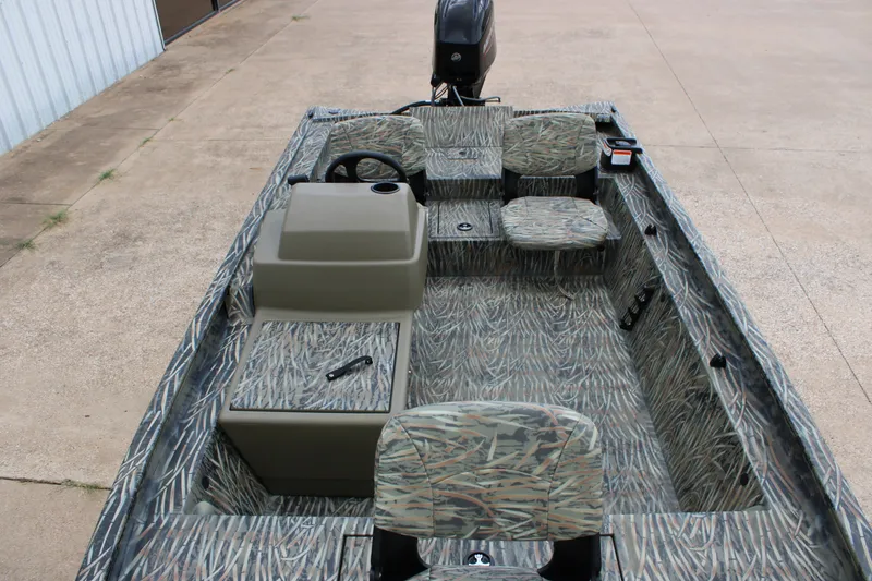 Slide: The Image of 2026 Tracker Grizzly 1754 SC boat with camouflage interior design. - 6