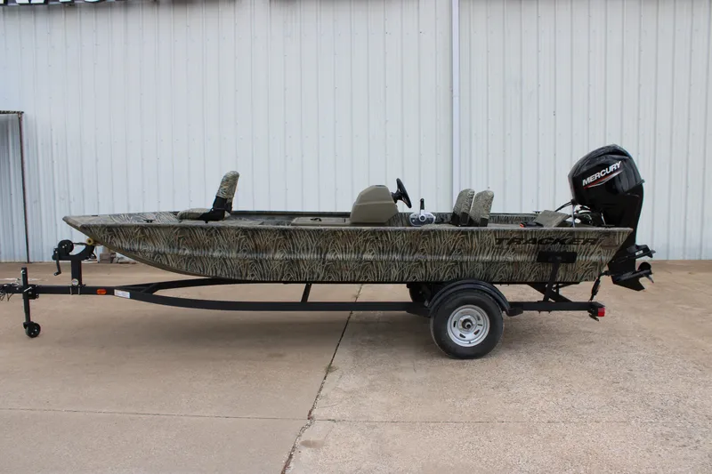 The Image of 2026 Tracker Grizzly 1754 SC boat on trailer, camo design, Mercury outboard motor. - 0