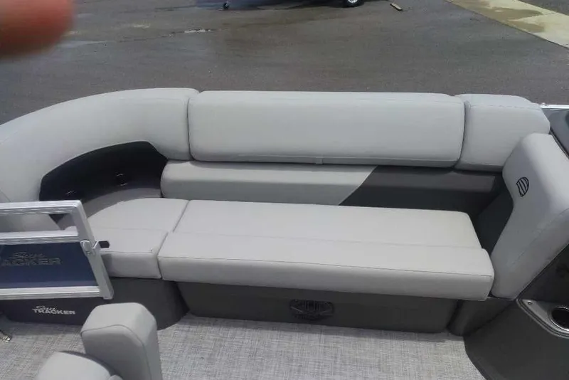 Slide: The Image of 2026 Sun Tracker SportFish 20 DLX boat interior with gray cushioned seating. - 10