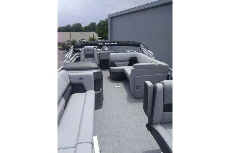 Slide: The Image of 2026 Sun Tracker SportFish 20 DLX pontoon boat with spacious seating and modern design. - 12