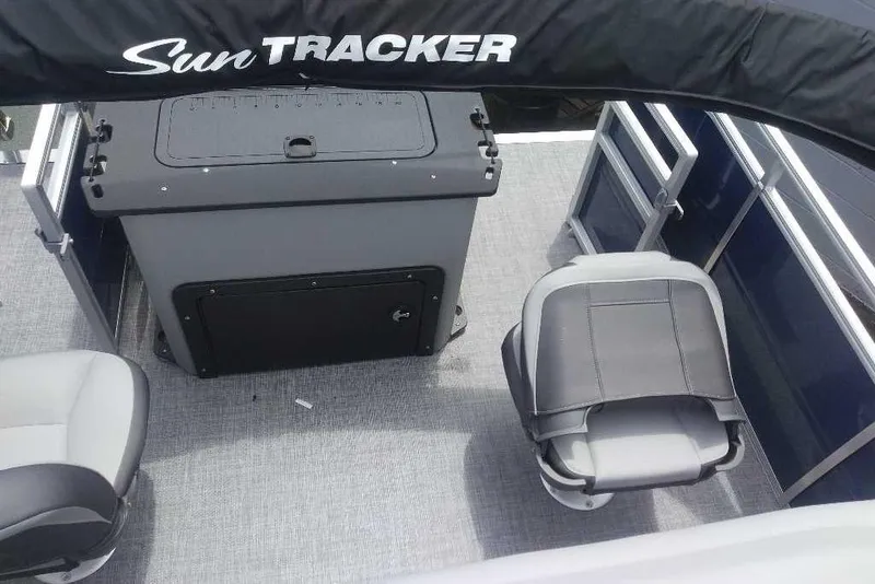 Slide: The Image of 2026 Sun Tracker SportFish 20 DLX interior with seating and storage compartments. - 8