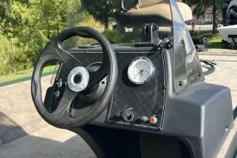 Slide: The Image of Steering console of 2026 Tracker Bass Tracker Classic Limited boat, featuring a sleek design. - 4