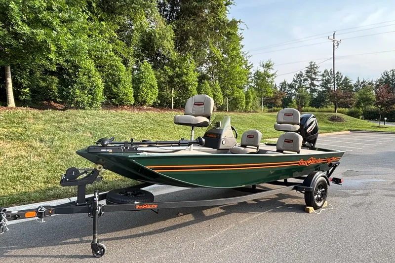 Slide: The Image of 2026 Tracker Bass Tracker Classic Limited boat on trailer, parked outdoors. - 2