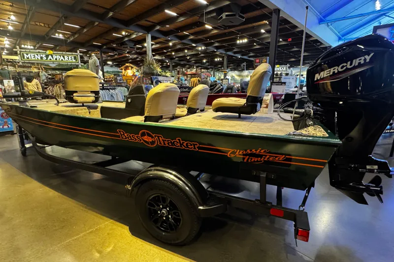 Slide: The Image of 2026 Tracker Bass Tracker Classic Limited boat displayed in a showroom. - 3