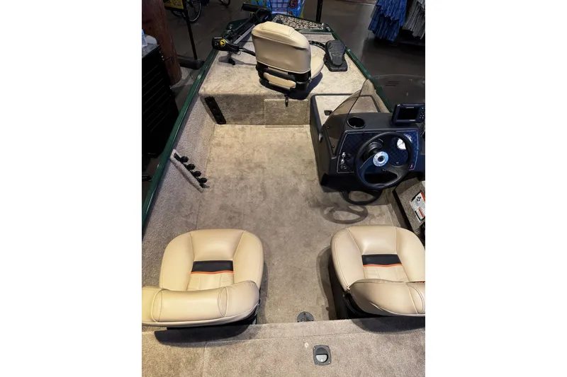 Slide: The Image of Interior view of a 2026 Tracker Bass Tracker Classic Limited with beige seats and a steering console. - 4