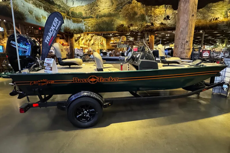 Slide: The Image of 2026 Tracker Bass Tracker Classic Limited boat displayed indoors on a trailer. - 44