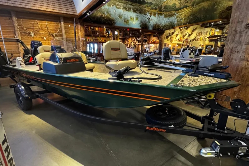 Slide: The Image of 2026 Tracker Bass Tracker Classic Limited boat displayed indoors with fishing gear. - 46