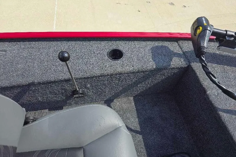 Slide: The Image of Interior view of 2026 Tracker Panfish 17 boat, featuring steering controls and seating. - 12