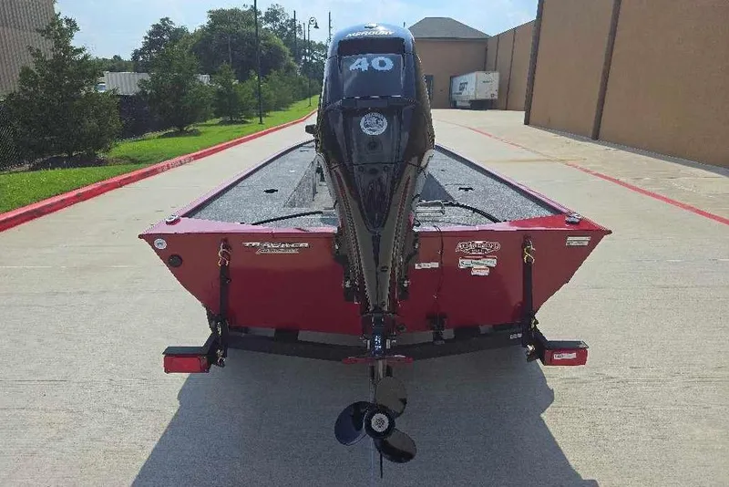 Slide: The Image of 2026 Tracker Panfish 17 boat with motor, parked on a concrete driveway. - 4