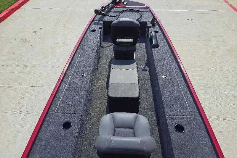 Slide: The Image of 2026 Tracker Panfish 17 boat interior with gray seating and red trim. - 5