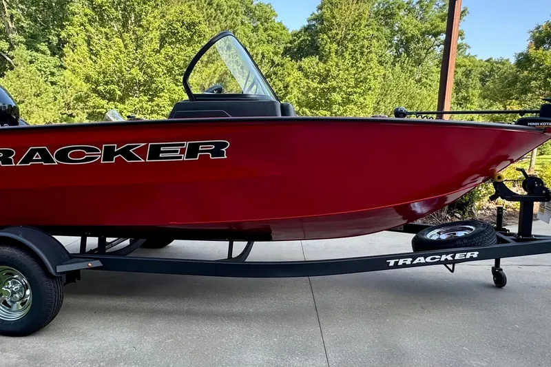 The Image of 2026 Tracker Pro Guide V-175 Combo boat in vibrant red on a trailer. - 0