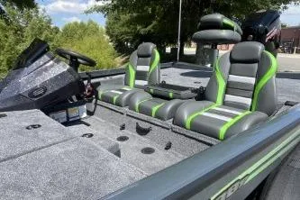 Slide: The Image of 2026 Ranger RT188P boat interior with green-accented seats, steering console, and spacious deck. - 5