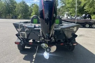 Slide: The Image of 2026 Ranger RT188P boat with outboard motor, parked outdoors on a sunny day. - 3