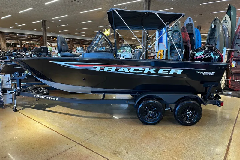The Image of 2026 Tracker Pro Guide V-175 Combo boat displayed indoors on a trailer. - 38