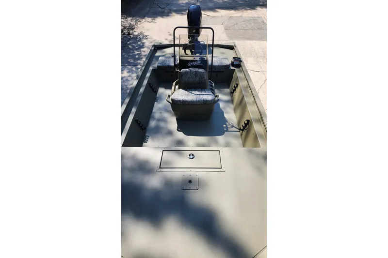 Slide: The Image of 2026 Tracker Grizzly 1860 CC boat interior with seating and storage compartments. - 5