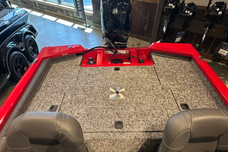 Slide: The Image of 2026 Tracker Pro Team 175 Crappie Edition boat interior with red accents and gray seating. - 13