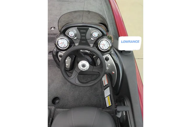 Slide: The Image of 2026 Tracker Bass Tracker Classic XL dashboard with steering wheel and Lowrance display. - 11