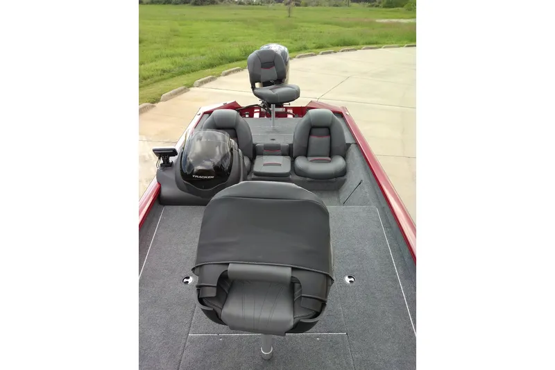 Slide: The Image of 2026 Tracker Bass Tracker Classic XL boat interior with seating and steering console. - 12