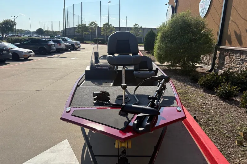 Slide: The Image of 2026 Tracker Bass Tracker Classic XL boat parked outdoors, showcasing sleek design and modern features. - 2