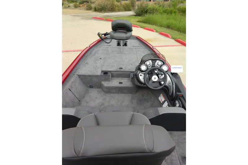 Slide: The Image of 2026 Tracker Bass Tracker Classic XL boat interior with steering console and seating. - 10