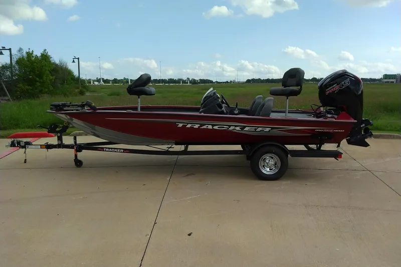 Slide: The Image of 2026 Tracker Bass Tracker Classic XL boat on trailer, parked outdoors. - 8