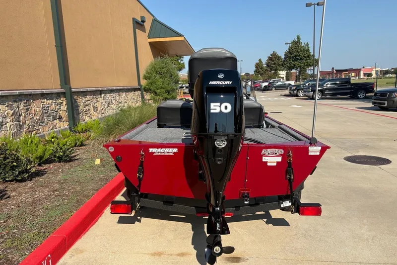 Slide: The Image of 2026 Tracker Bass Tracker Classic XL boat with Mercury 50 engine in parking lot. - 6
