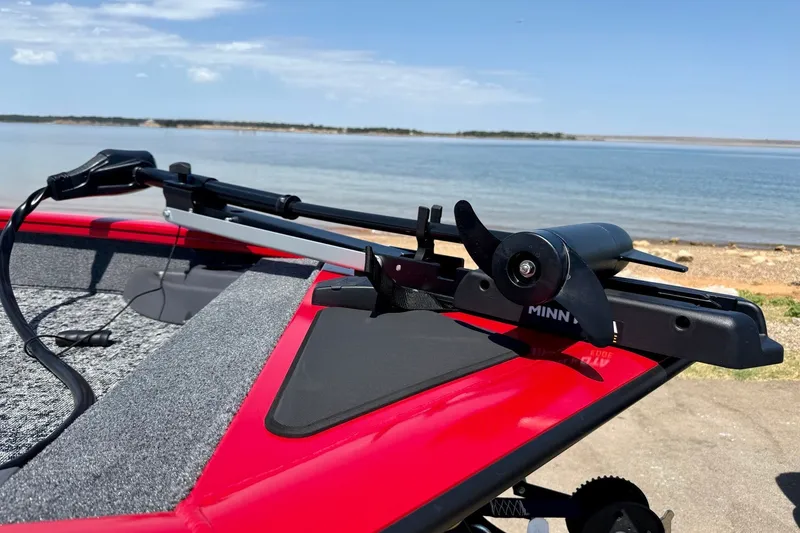 Slide: The Image of 2026 Tracker Pro Team 175 Crappie Edition boat with Minn Kota trolling motor by a lake. - 15