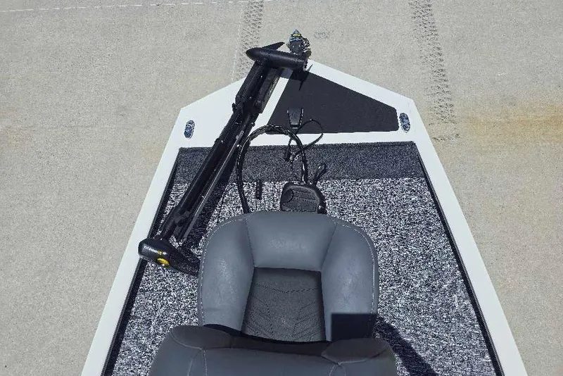 Slide: The Image of 2026 Tracker Pro 170 boat interior with seat and trolling motor on deck. - 11