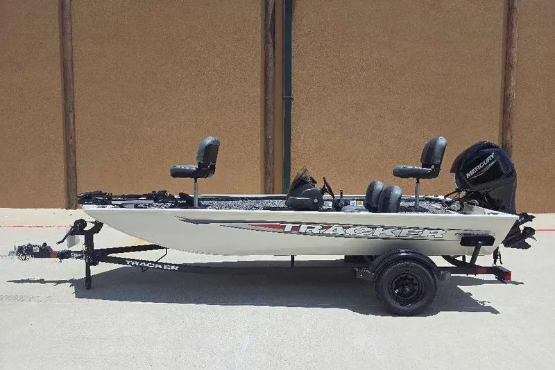 The Image of 2026 Tracker Pro 170 fishing boat on trailer, featuring Mercury outboard motor. - 0