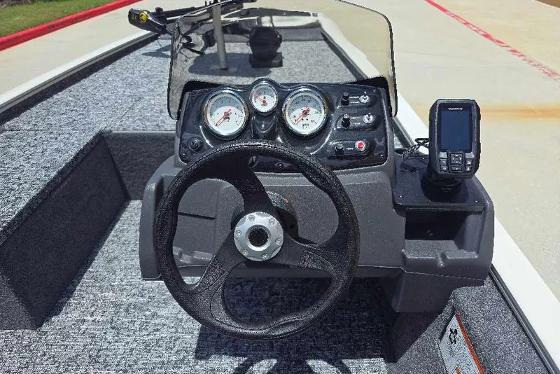 Slide: The Image of 2026 Tracker Pro 170 boat dashboard with steering wheel and gauges. - 7