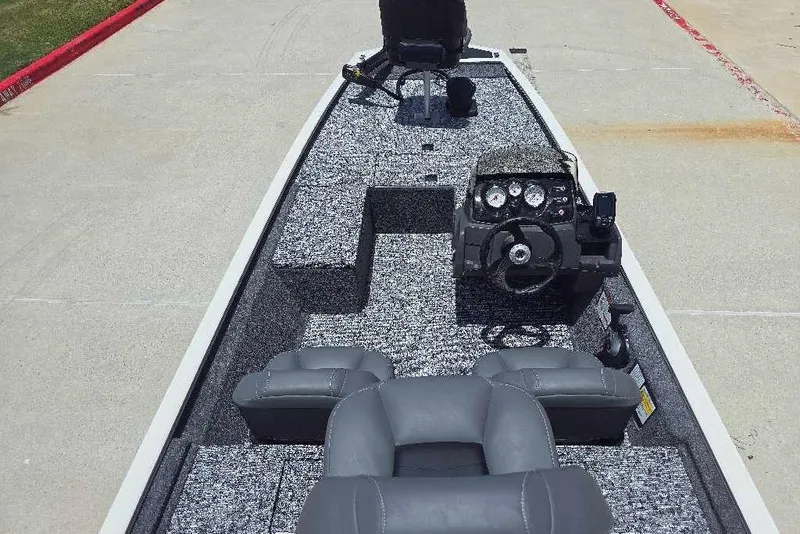 Slide: The Image of 2026 Tracker Pro 170 boat interior with steering console and seating. - 6