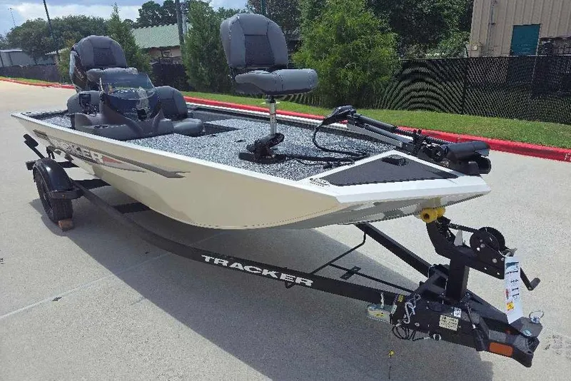 Slide: The Image of 2026 Tracker Pro 170 fishing boat on trailer, parked outdoors. - 3