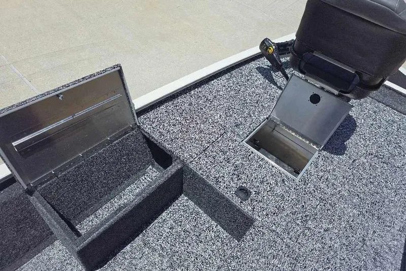 Slide: The Image of 2026 Tracker Pro 170 boat deck with open storage compartments and seating. - 10