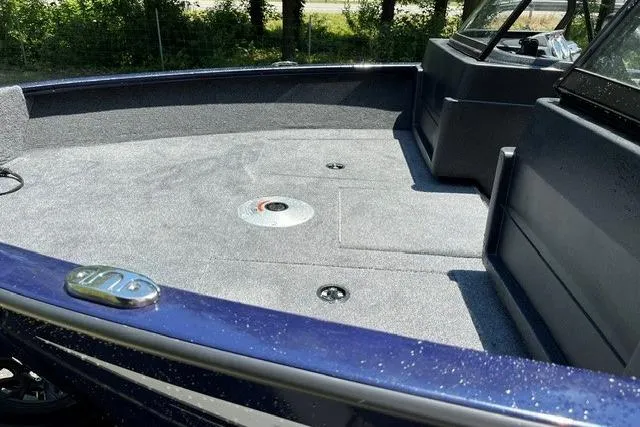 Slide: The Image of 2026 Tracker Pro Guide V-175 WT boat interior with spacious deck and seating. - 11
