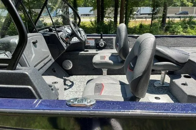 Slide: The Image of 2026 Tracker Pro Guide V-175 WT boat interior with modern seating and control panel. - 13