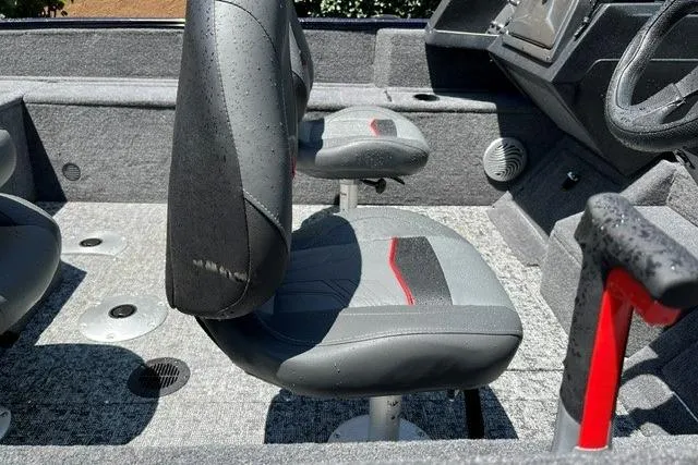 Slide: The Image of 2026 Tracker Pro Guide V-175 WT boat interior with gray seats and modern dashboard. - 7