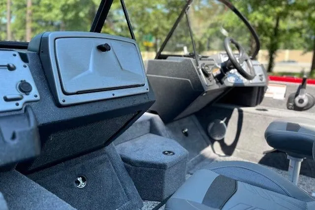 Slide: The Image of 2026 Tracker Pro Guide V-175 Combo boat interior with steering wheel and seating. - 9