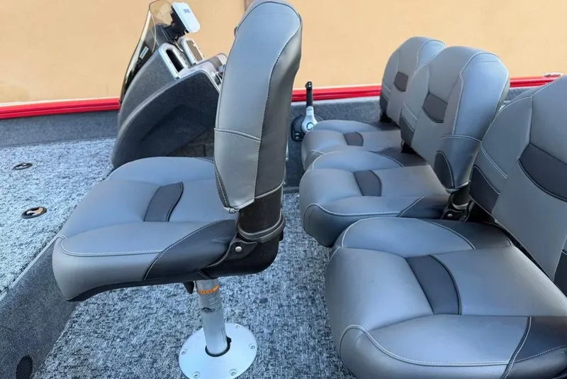 Slide: The Image of 2026 Tracker Pro Team 175 Crappie Edition boat seats, featuring sleek gray upholstery. - 15