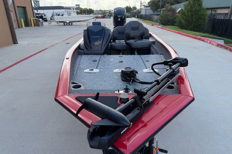 Slide: The Image of 2026 Tracker Pro Team 175 Crappie Edition boat, red exterior, parked on concrete. - 10