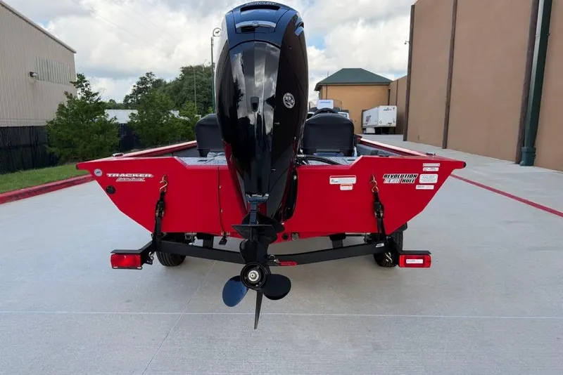 Slide: The Image of 2026 Tracker Pro Team 175 Crappie Edition boat, red, rear view with motor. - 8
