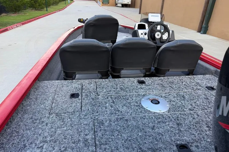 Slide: The Image of 2026 Tracker Pro Team 175 Crappie Edition boat interior with steering wheel and seating. - 7