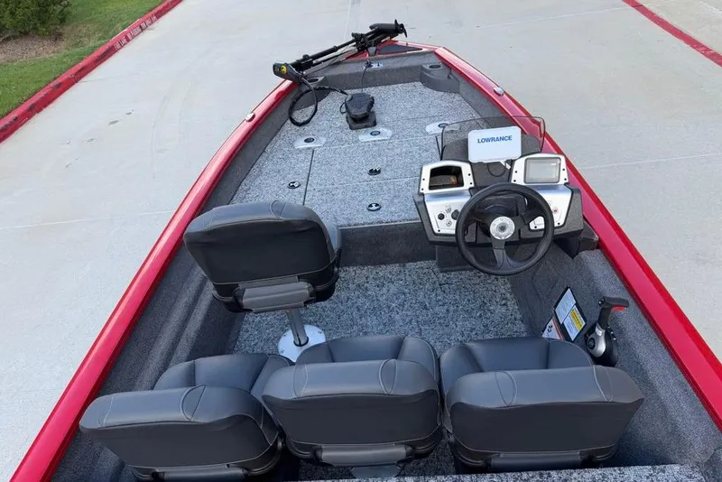 Slide: The Image of 2026 Tracker Pro Team 175 Crappie Edition boat interior with steering console and seating. - 19