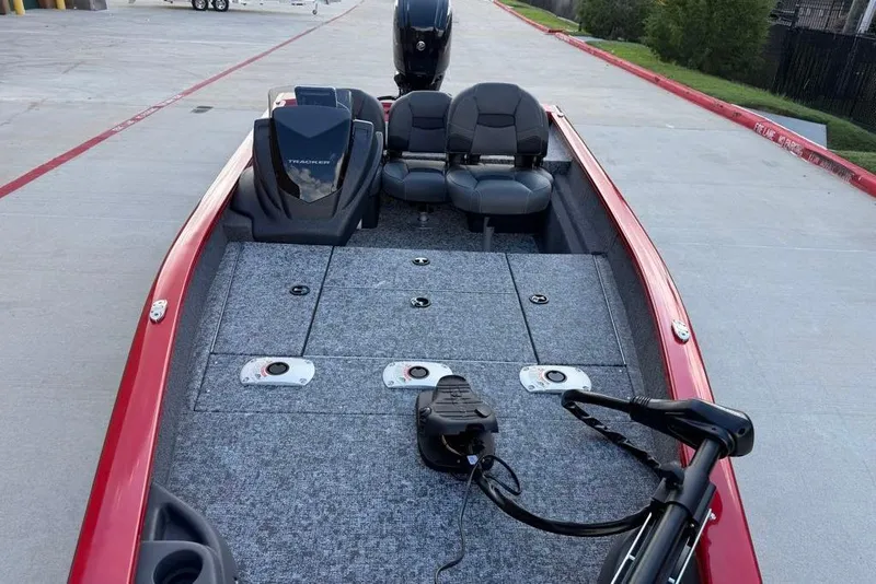 Slide: The Image of 2026 Tracker Pro Team 175 Crappie Edition boat with red exterior and spacious seating. - 18